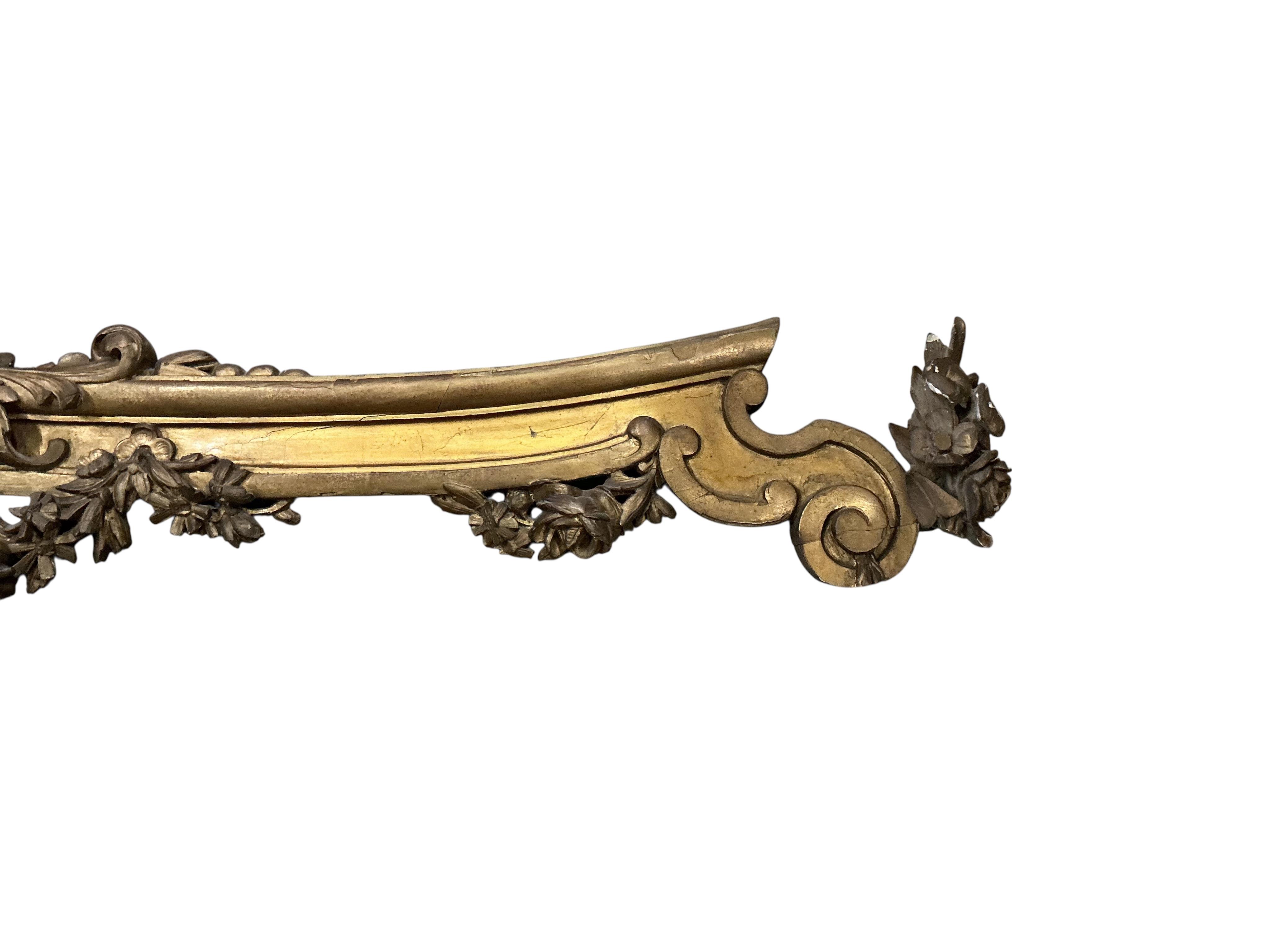 A Victorian carved giltwood pediment, length 200cm